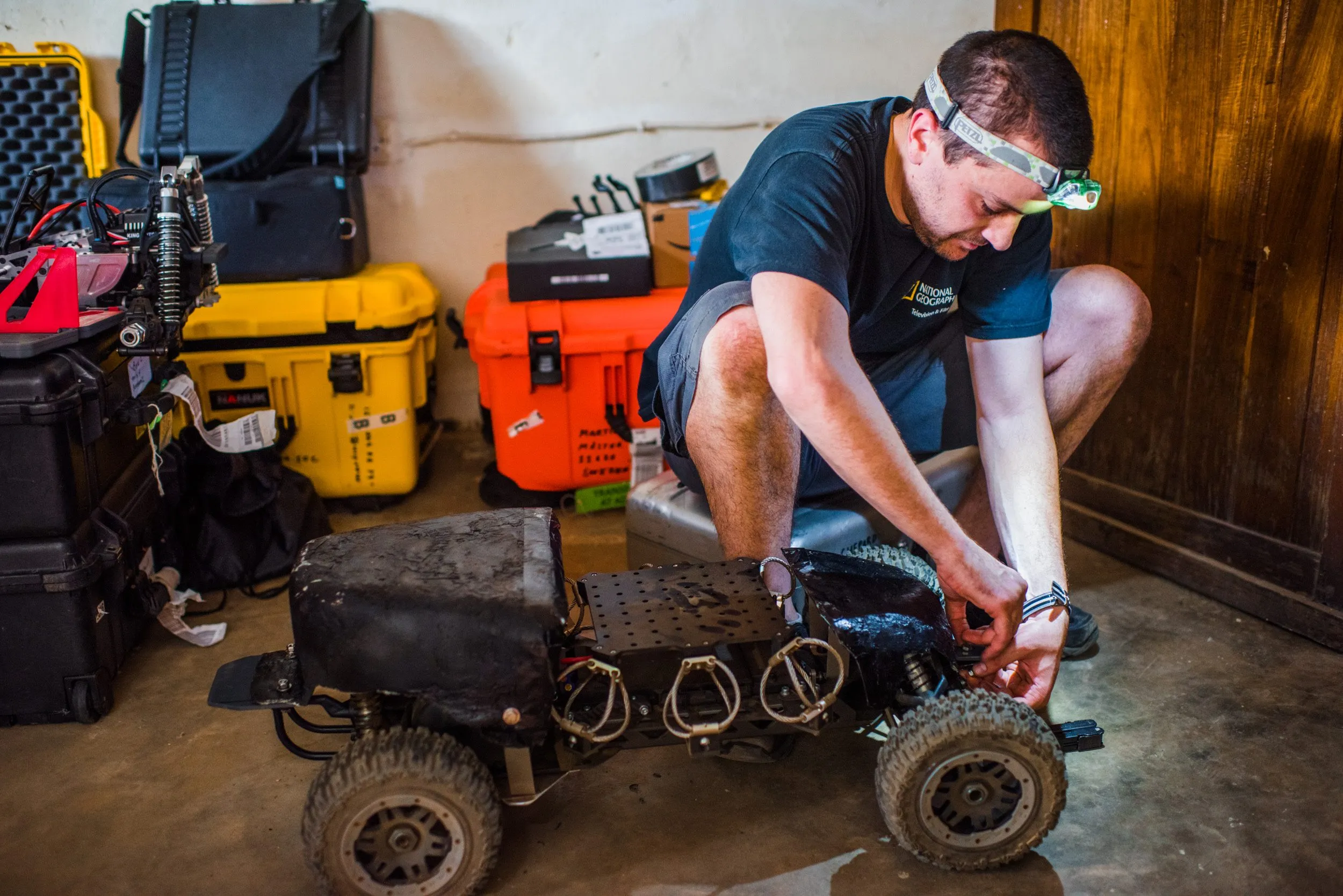 Mike Shepard of the National Geographic Remote Imaging team assembling the armored camera vehicle.
