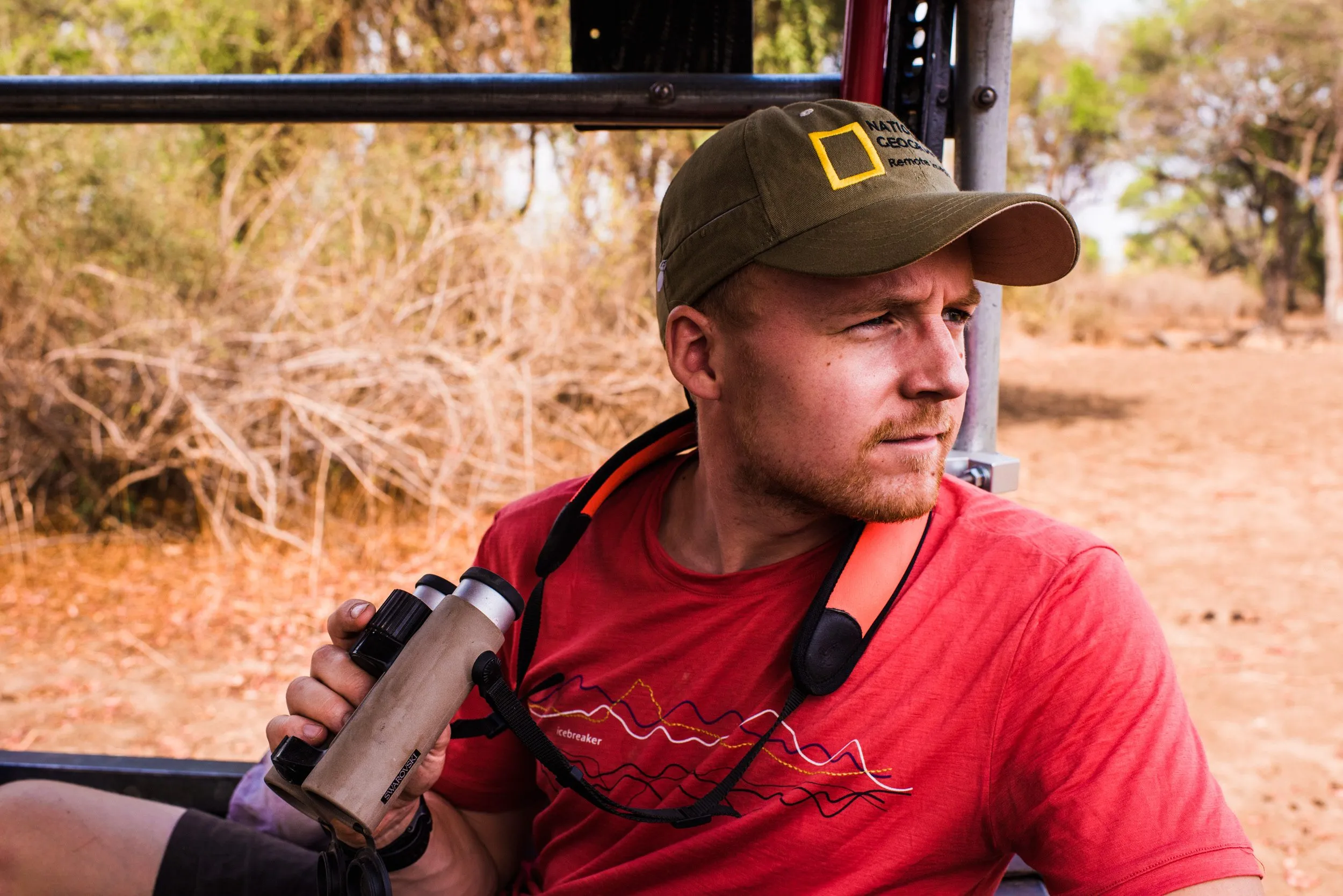 Martin Edström sitting in the back of a Land Rover looking for lions in South Luangwa National Park, Zambia.