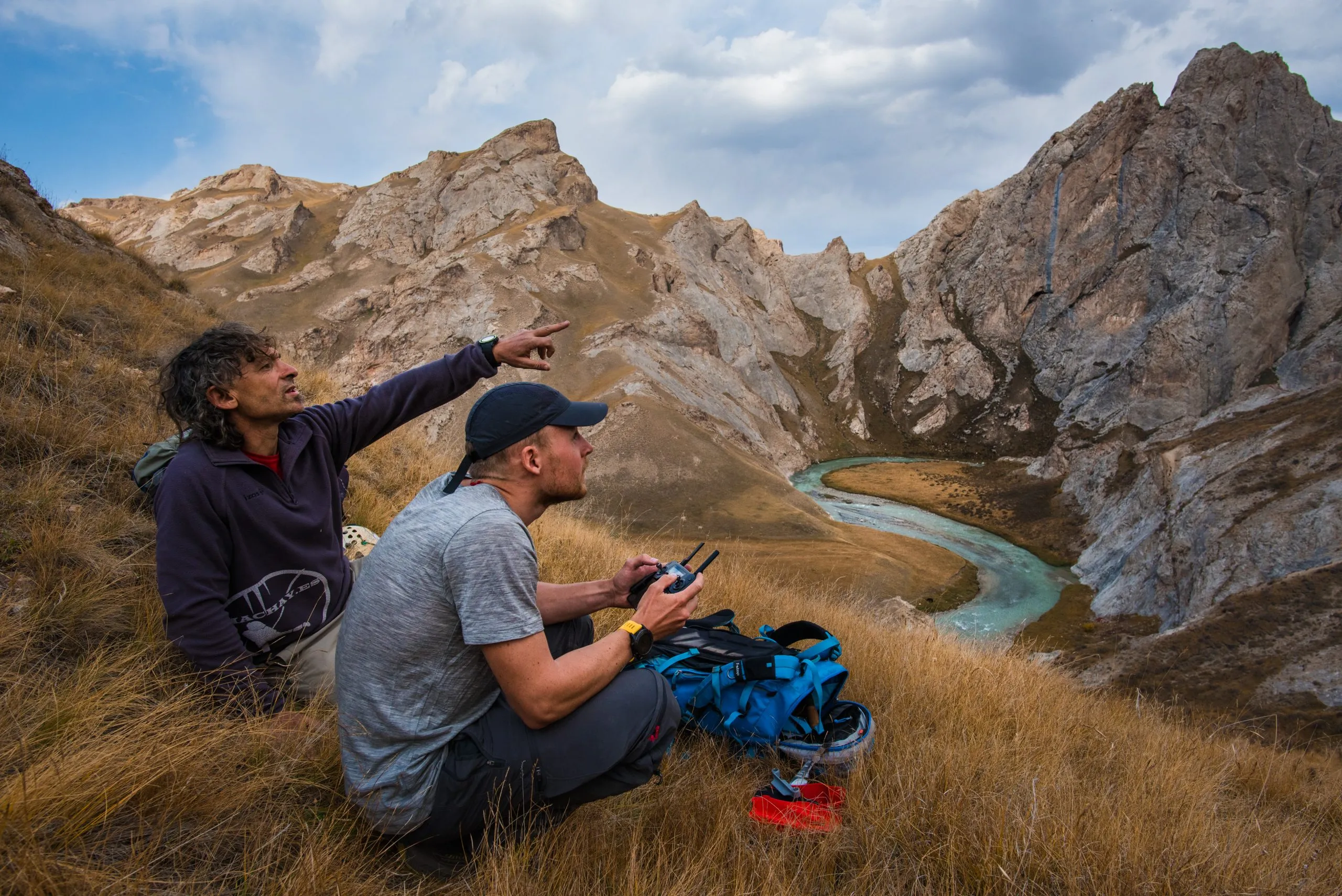 Cecilio Lopez Tercero and Martin Edström guiding the drone from afar, flying up to a potential new cave opening.