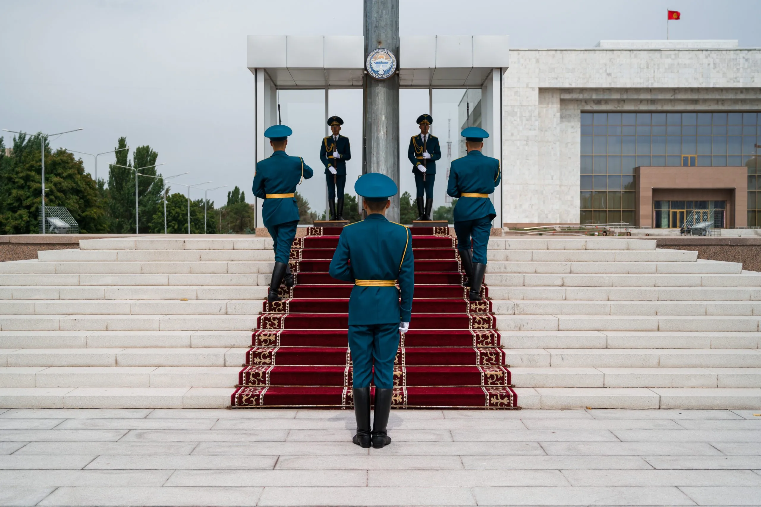 Kyrgyz honour-guard soldiers in turquoise uniforms stand at attention during a flag-raising ceremony on Ala-Too Square in Bishkek.