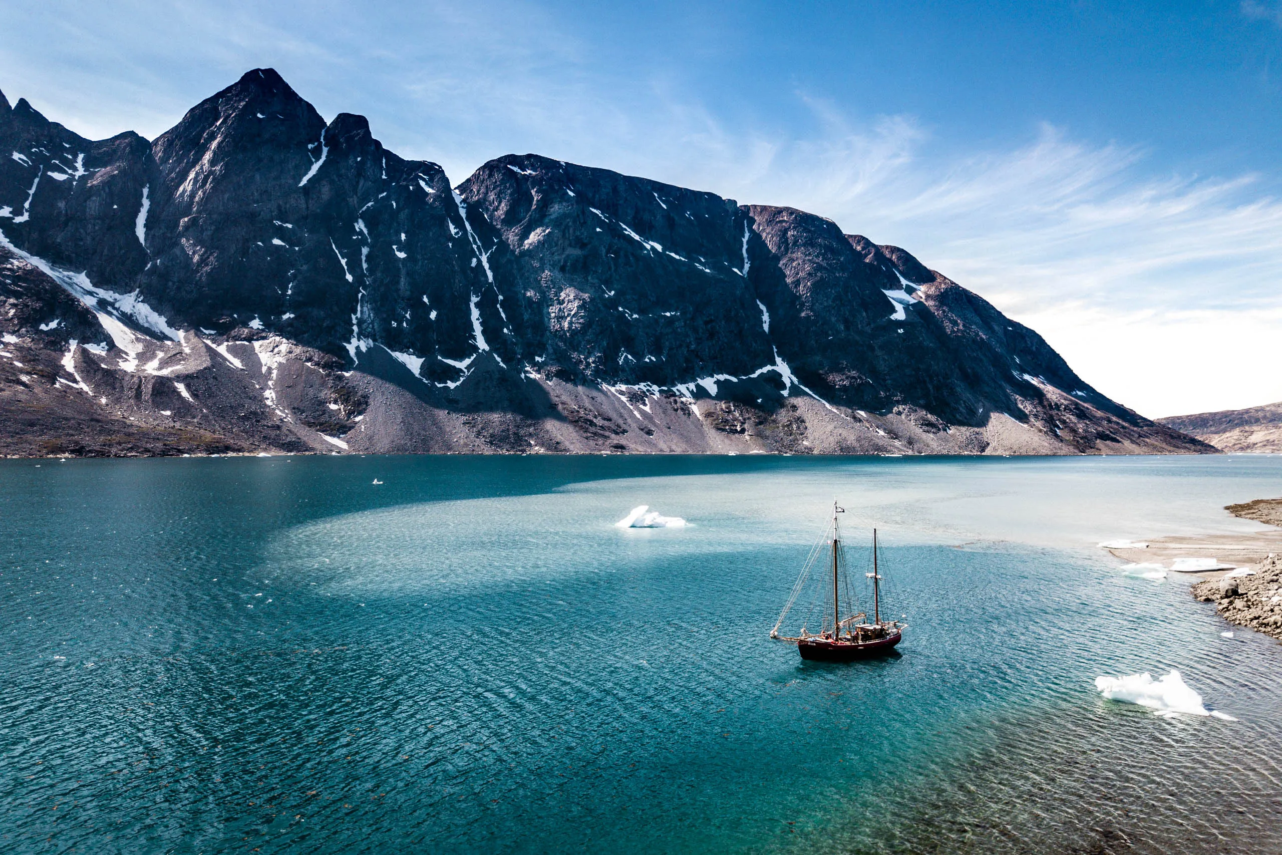 An aerial view over the icy fjords of Eastern Greenland.