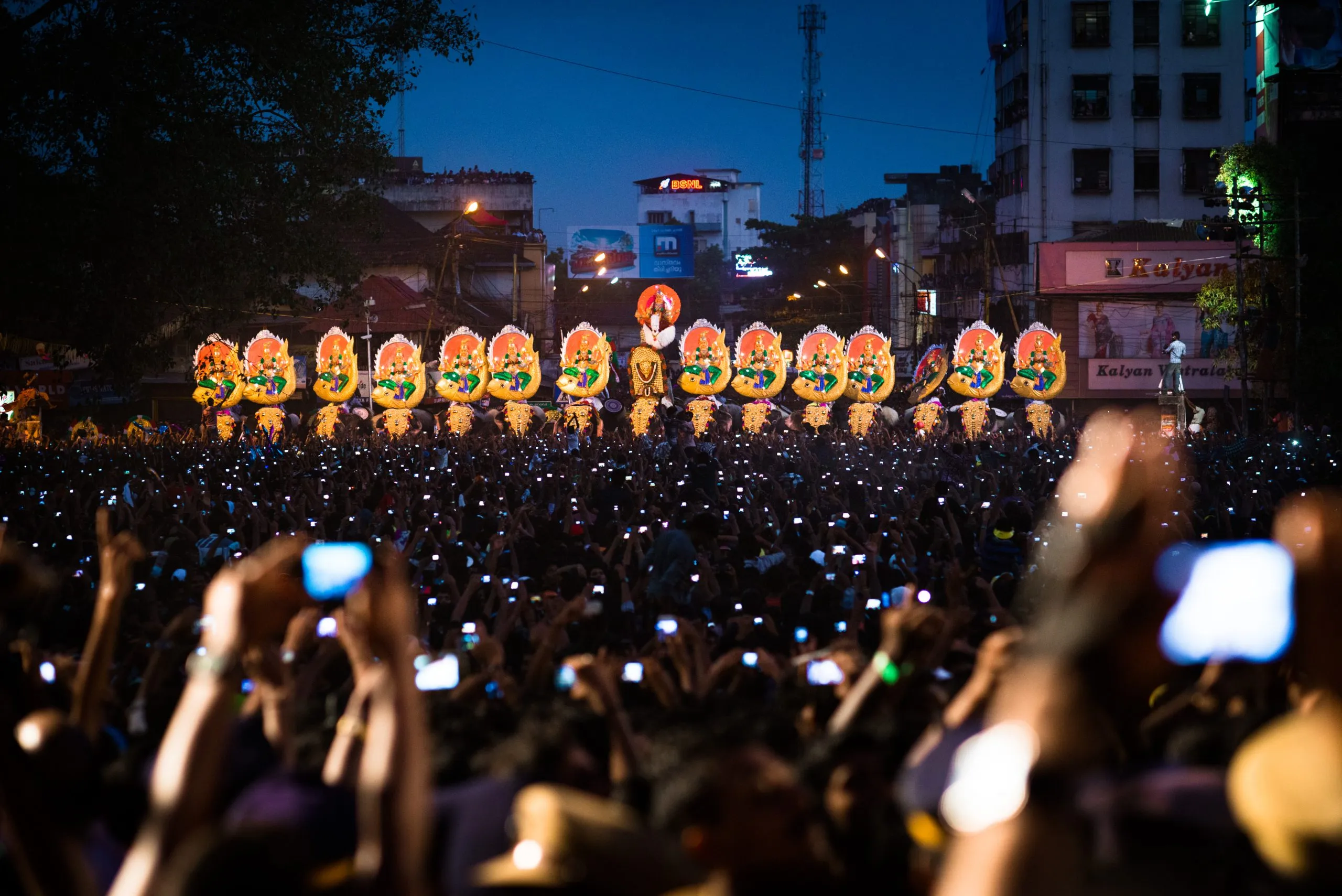 Crowds gather at the Thrissur Pooram festival on the slopes of Vadakkunnathan temple, India.
