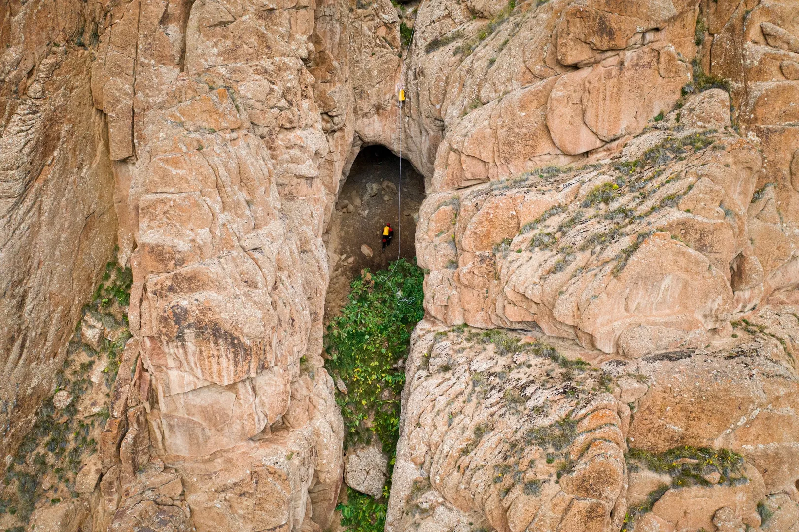 Expert caver Carlos Sanchez descends into a newly discovered cave entrance to inspect it and see if it continues further.