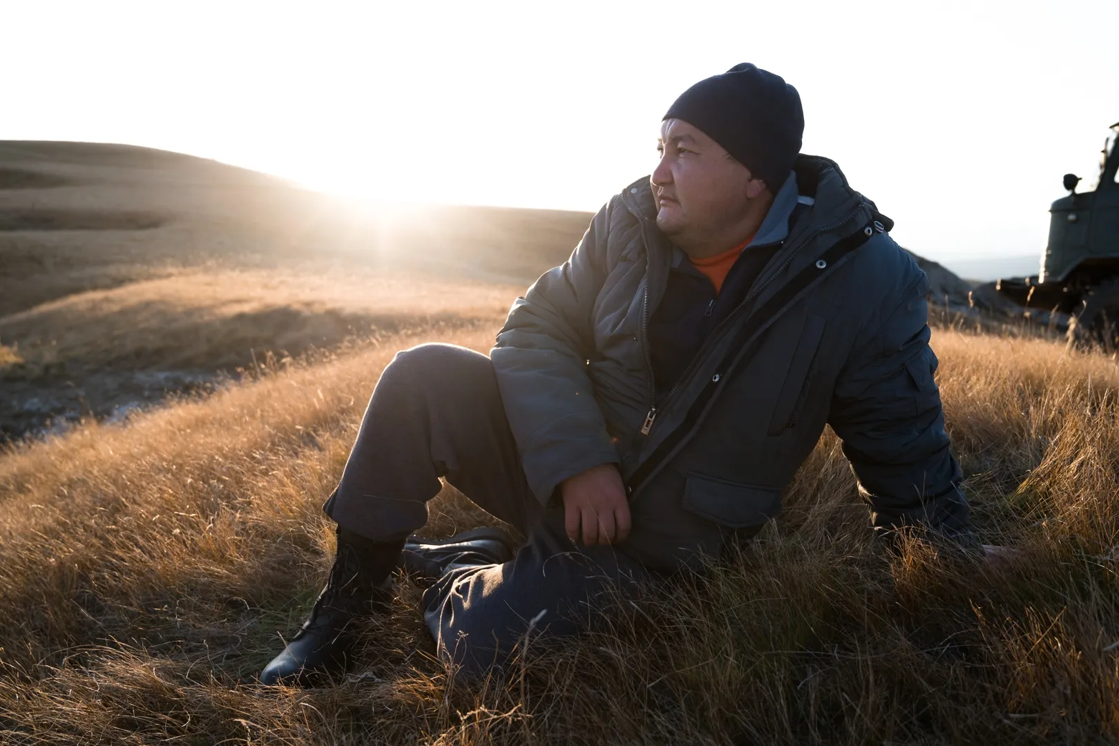Local team member and translator Tolonbek Rasulov looking out over the valley of Kok Kiya, resting after a long day of work with the team.